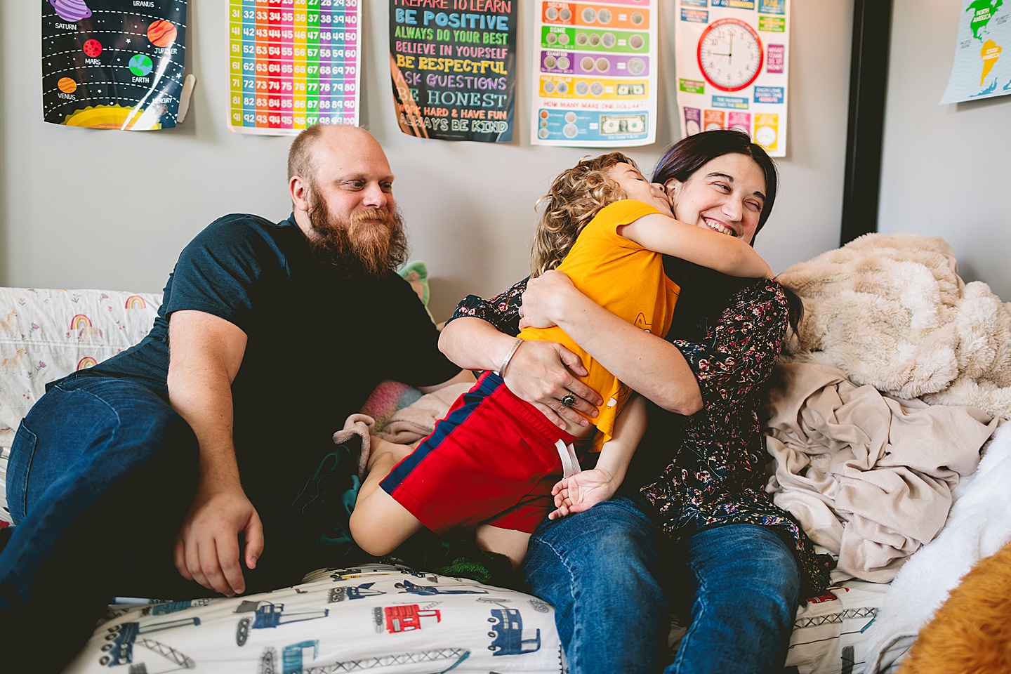 At home family photos of mom and dad wrestling with child