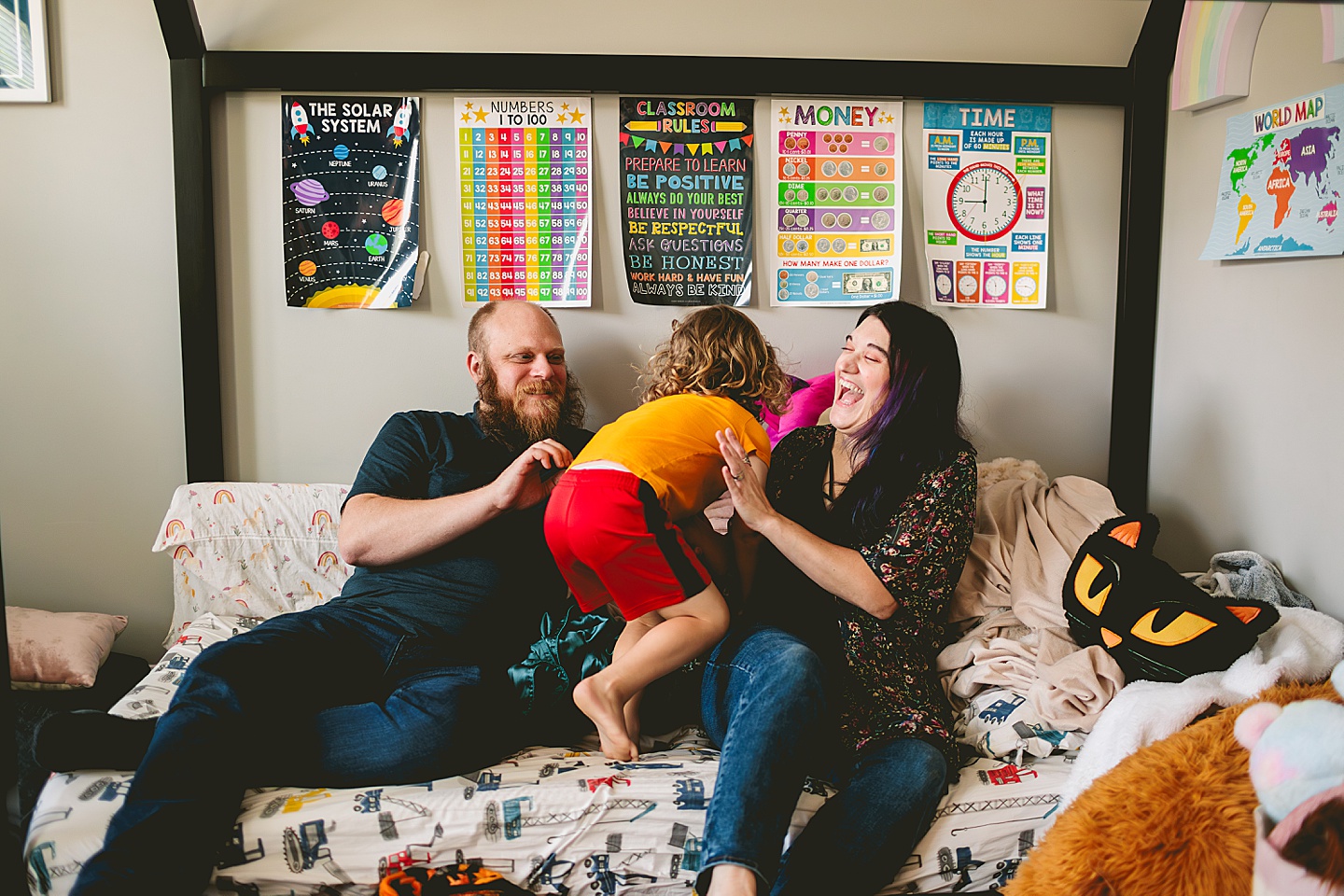 At home family photos of mom and dad wrestling with child