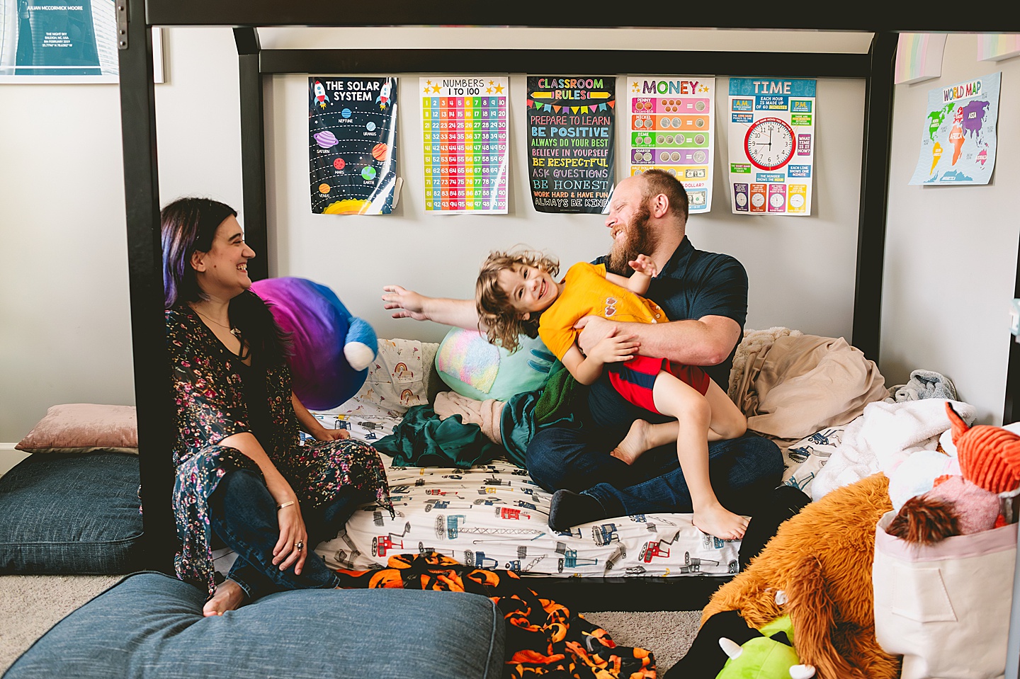 Parents goofing around with kid