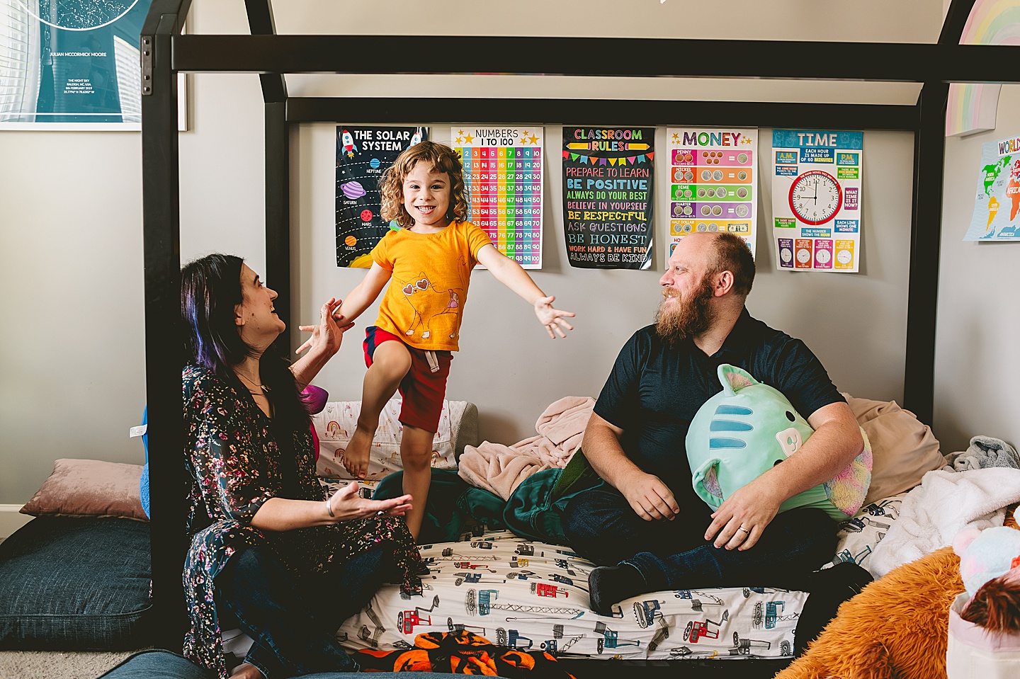 Parents goofing around with kid