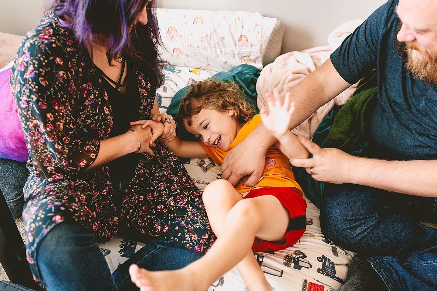 Parents goofing around with kid