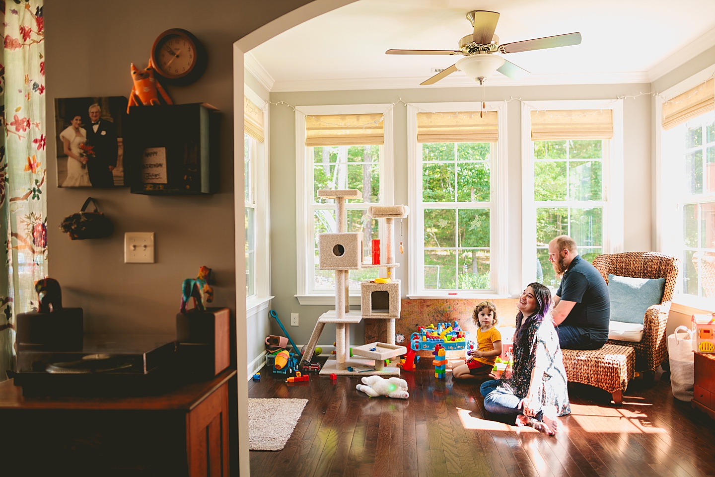 Family playing with blocks in sunroom