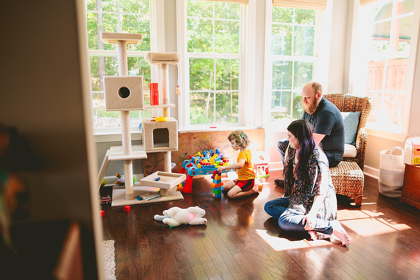 Family playing with blocks in sunroom