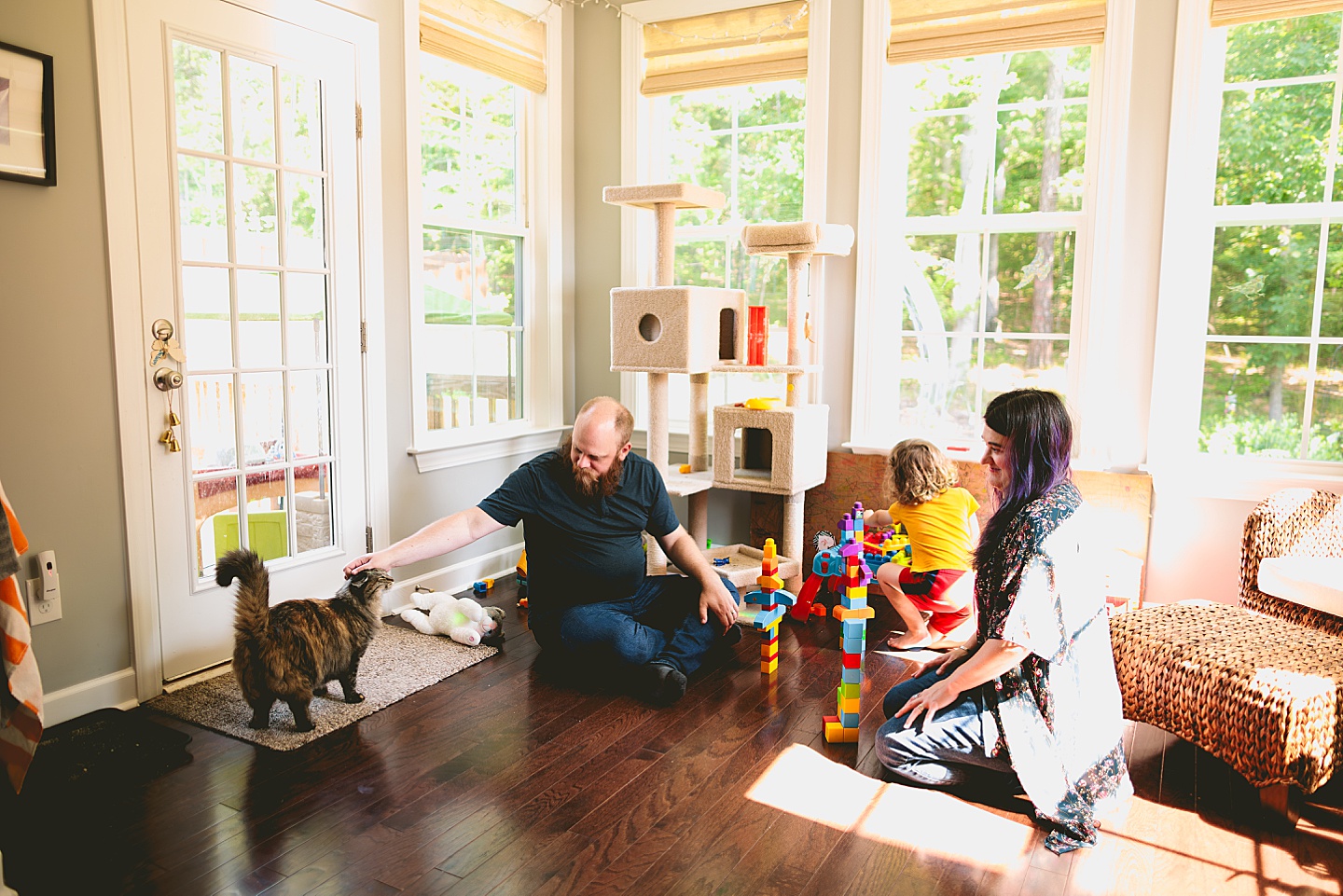 Family playing with blocks in sunroom
