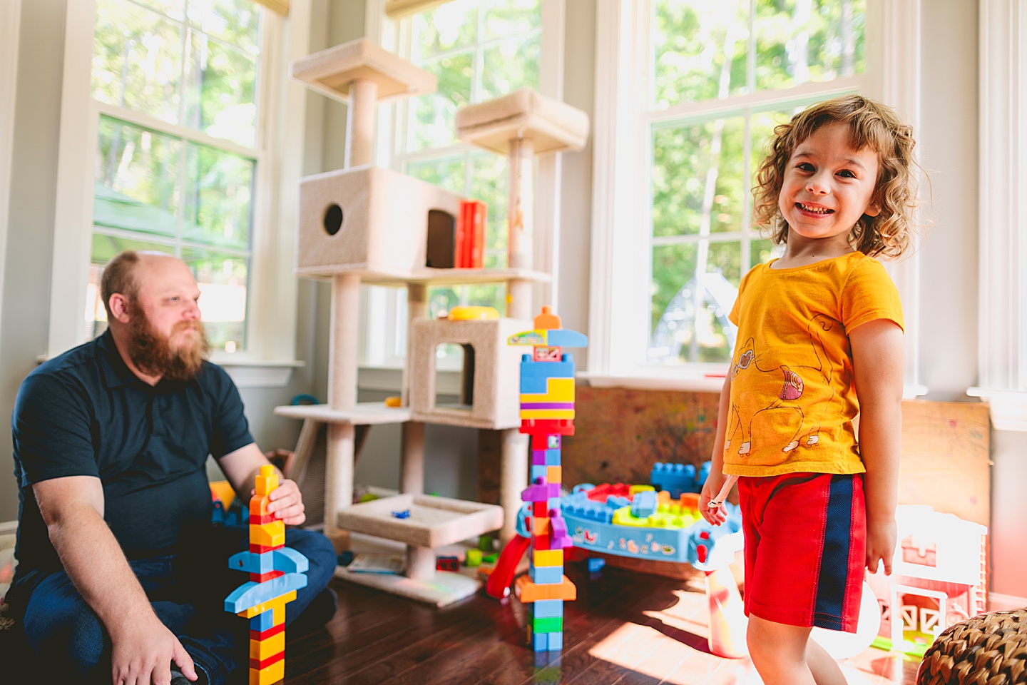 Family playing with blocks in sunroom