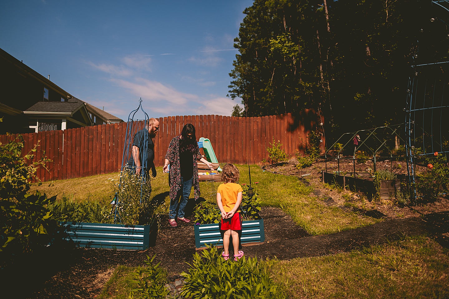 Family photos in Holly Springs of a family gardening in their backyard