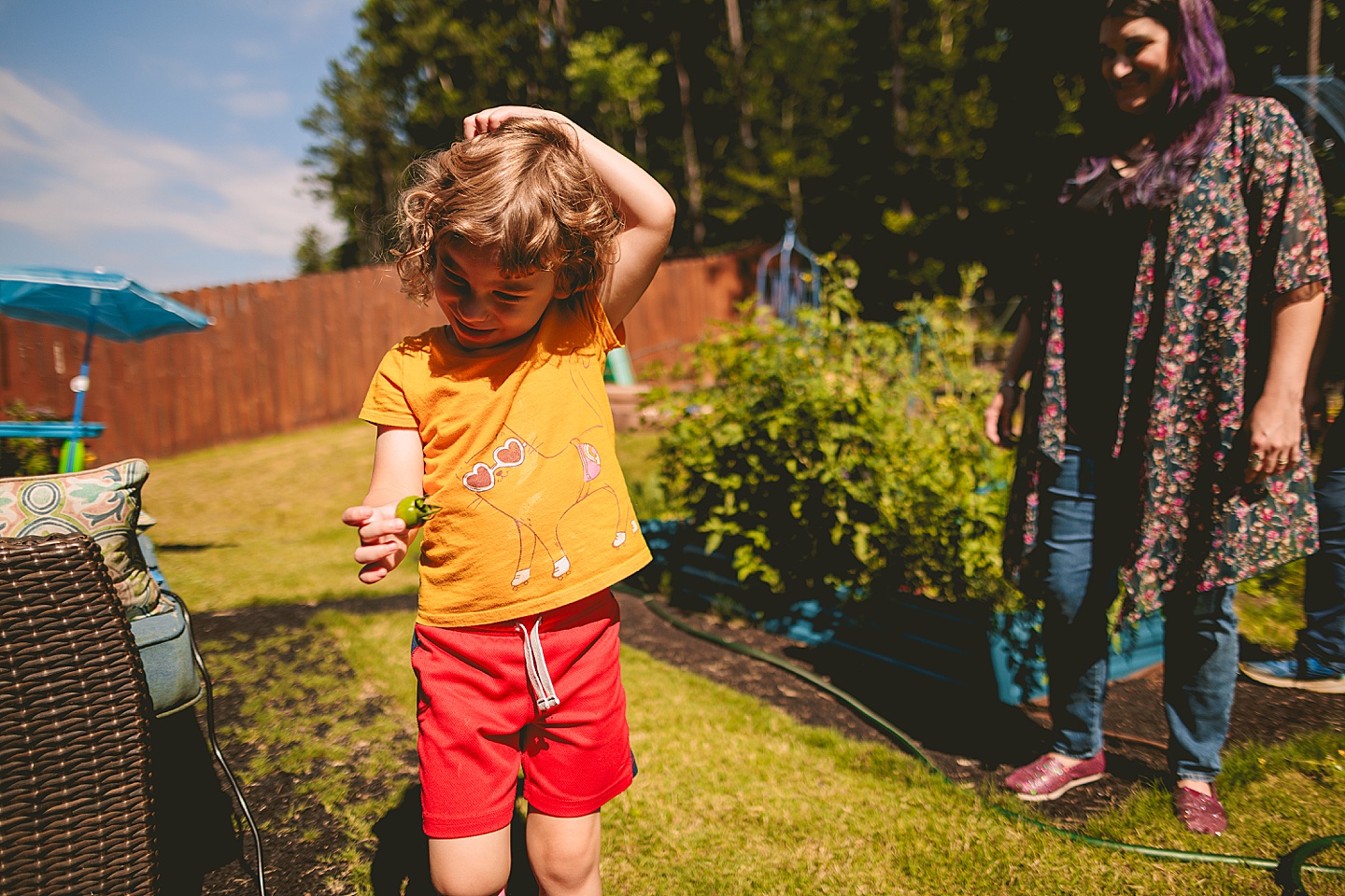 Family photos in Holly Springs of a family gardening in their backyard