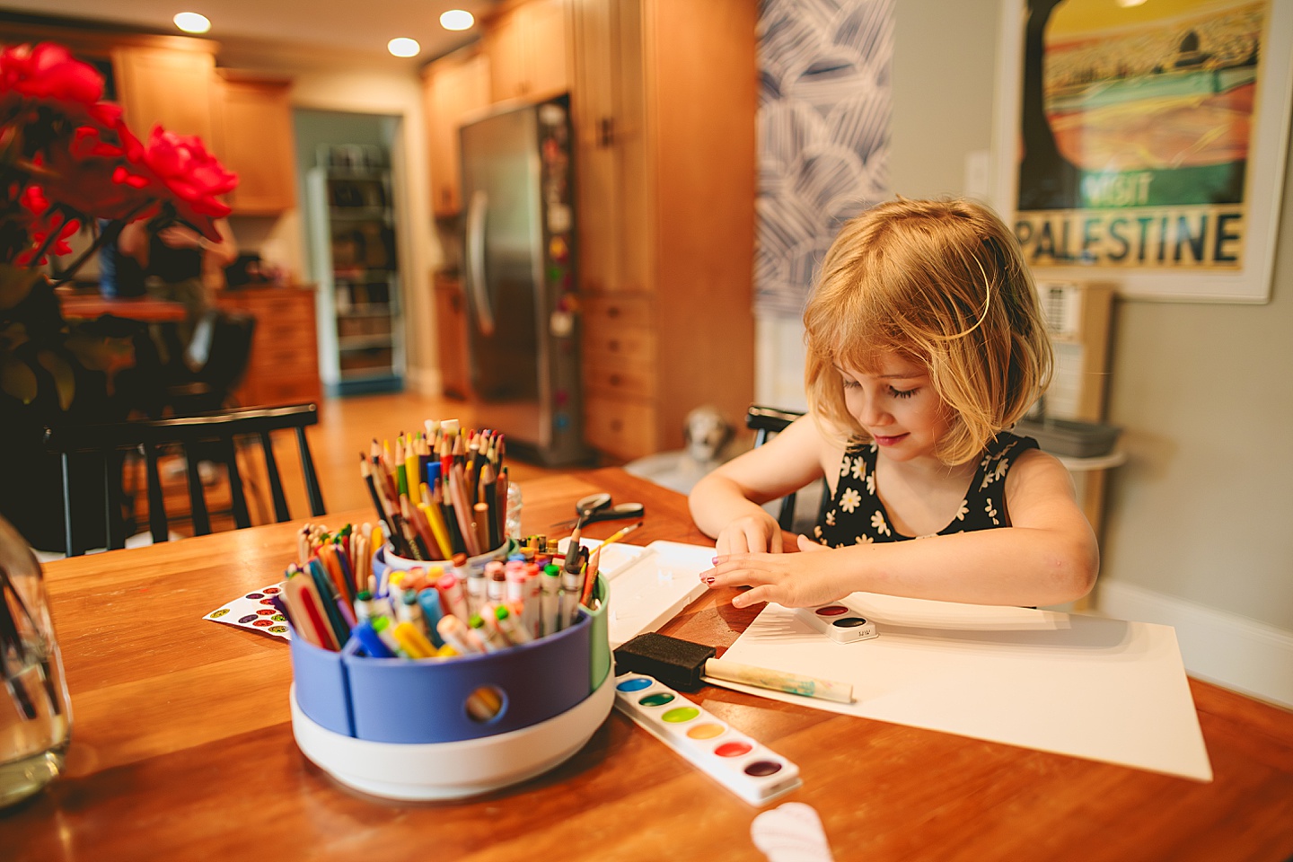 Kid painting in dining room