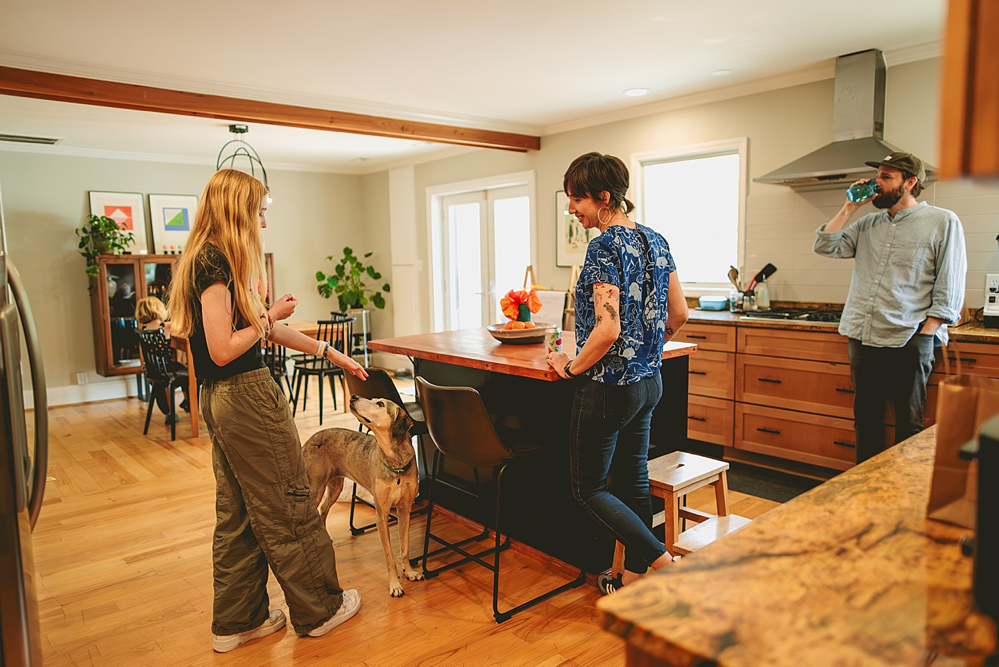 Family talking in kitchen