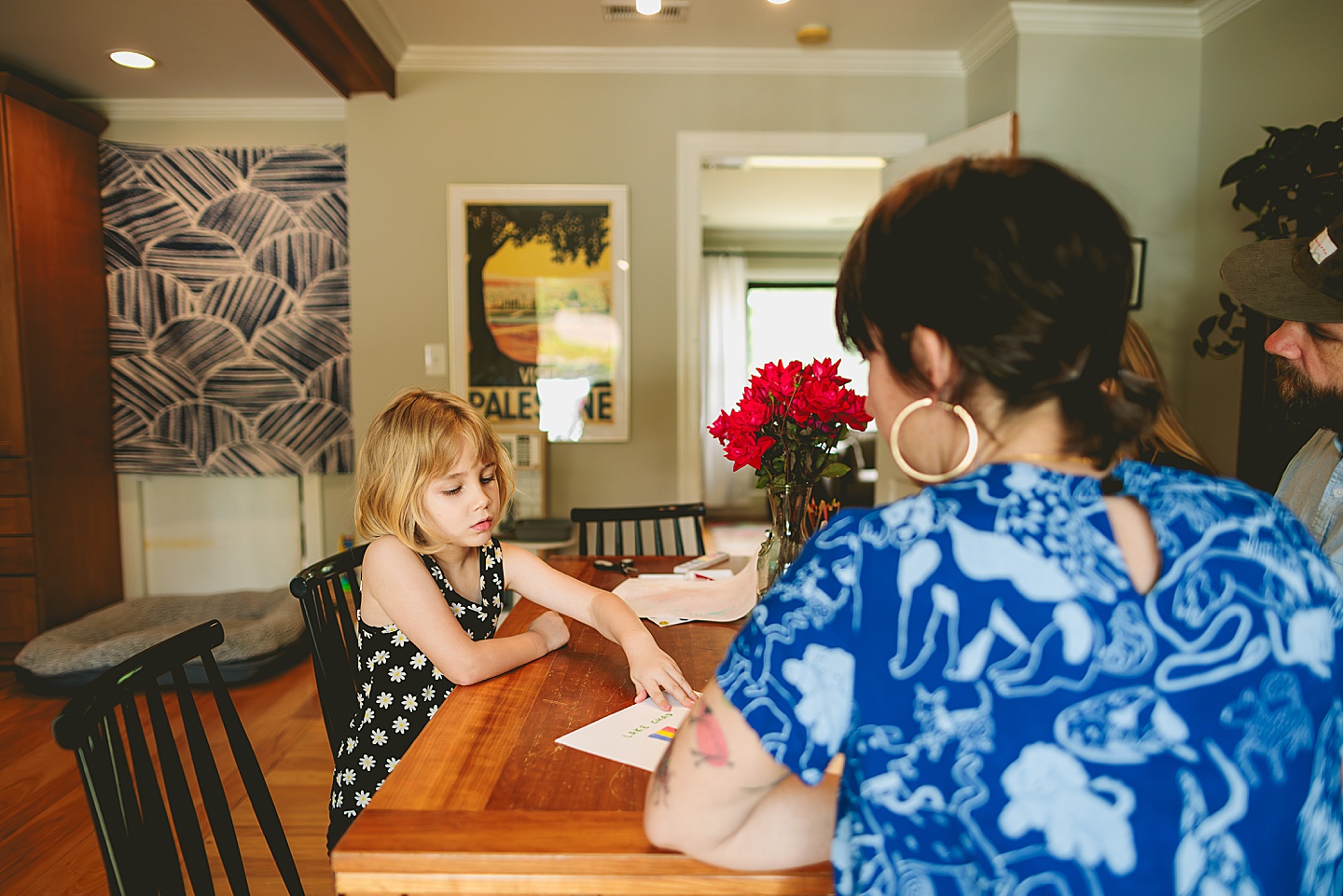 Family painting together in dining room