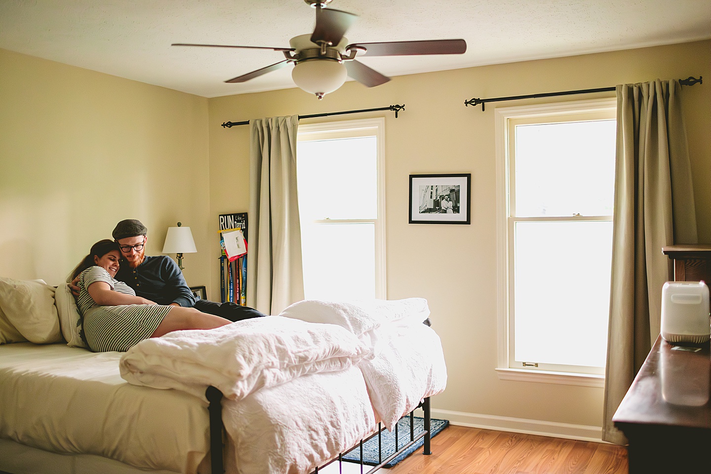 Couple cuddling on bed