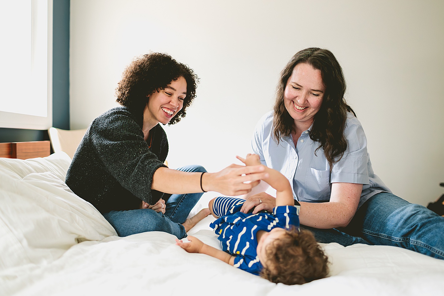 Toddler at home with moms