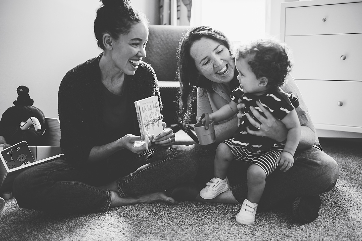 Moms reading to daughter