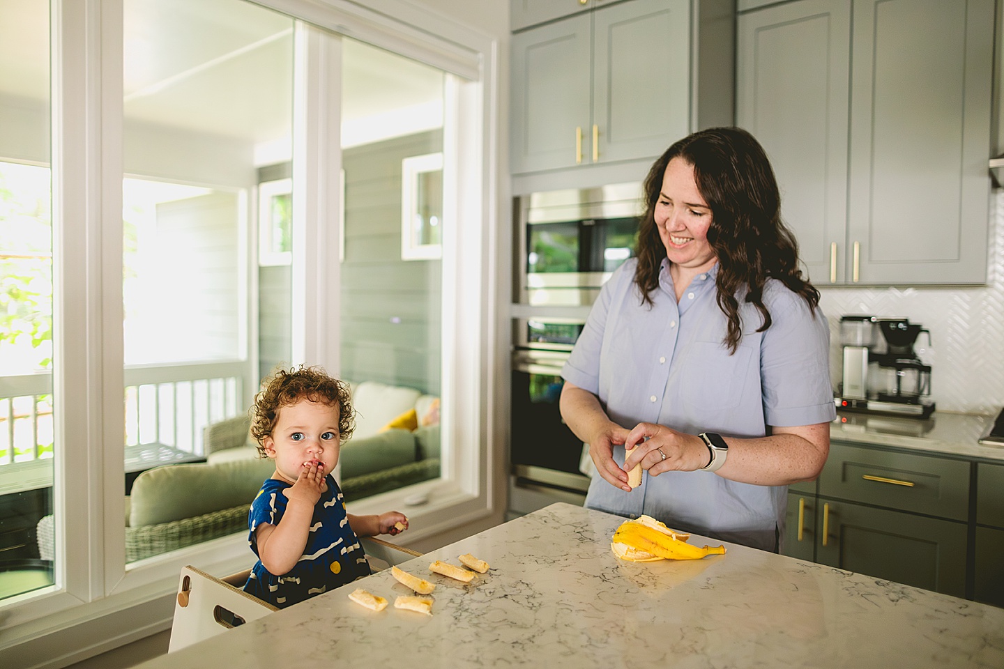 Mom feeding bananas to baby as lunch snack