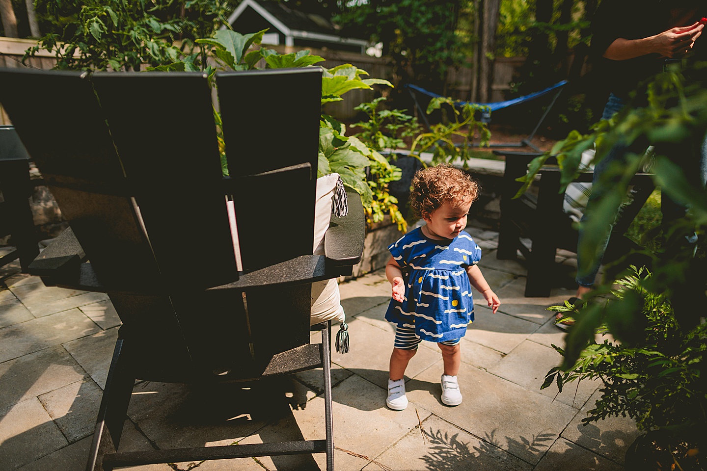 Toddler walking around garden