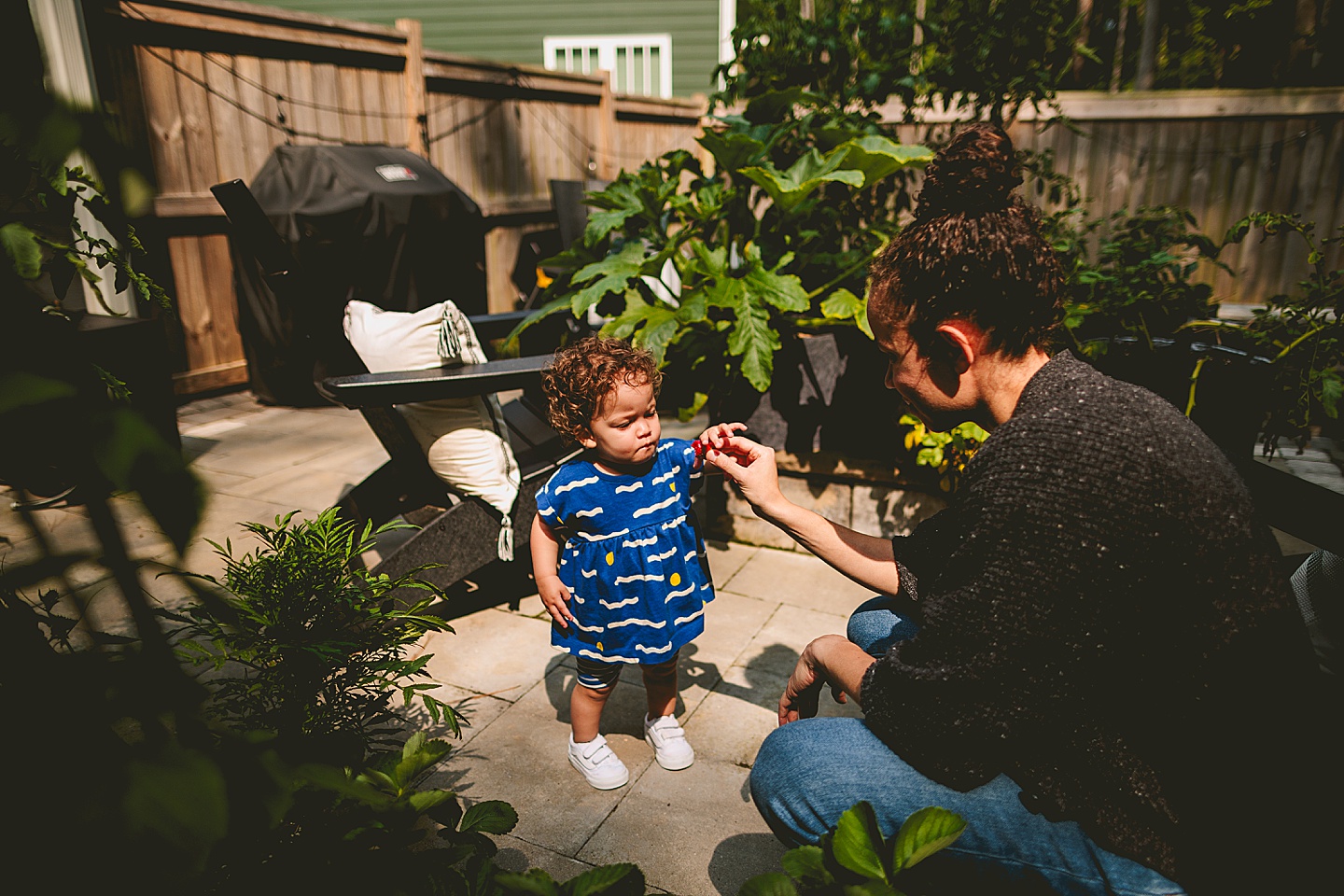 Toddler walking around garden