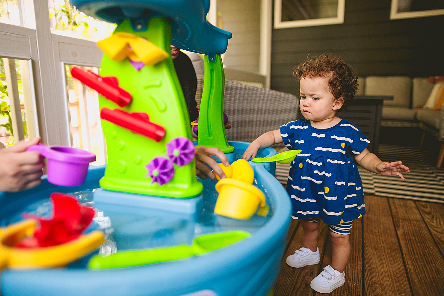 Baby playing with water table