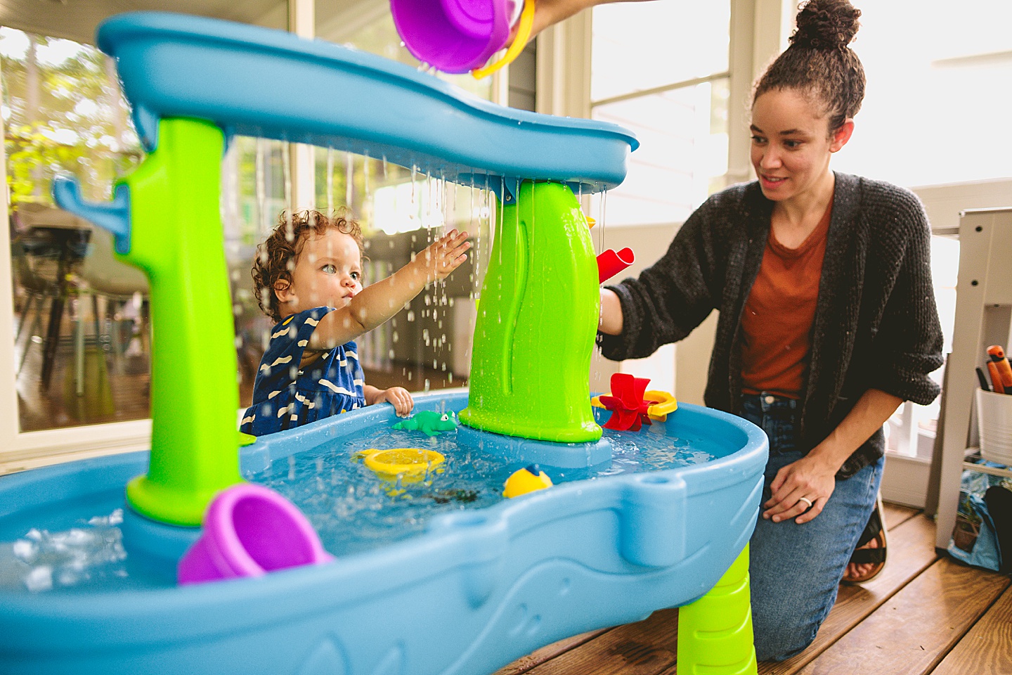 Baby playing with water table