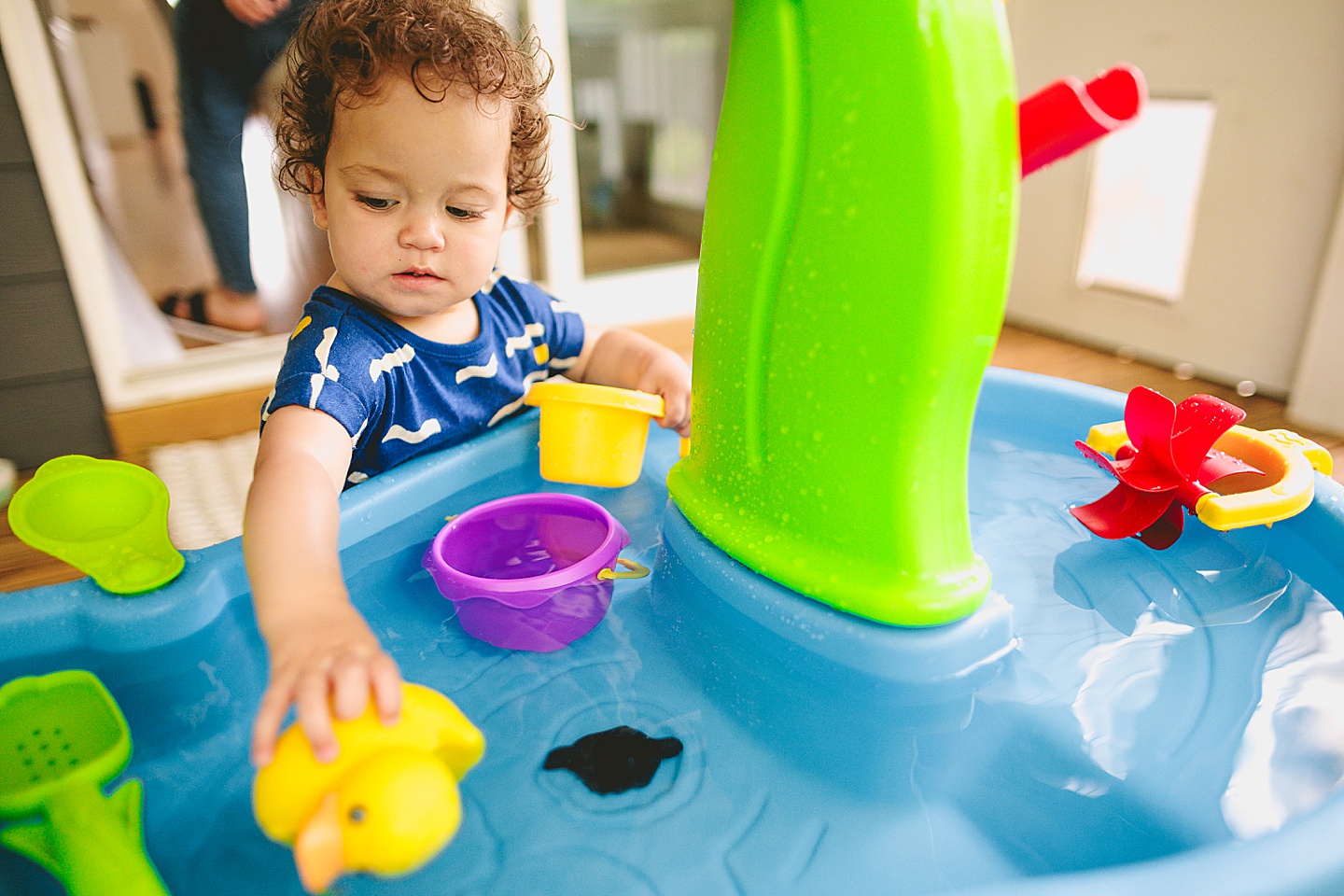 Baby playing with water table