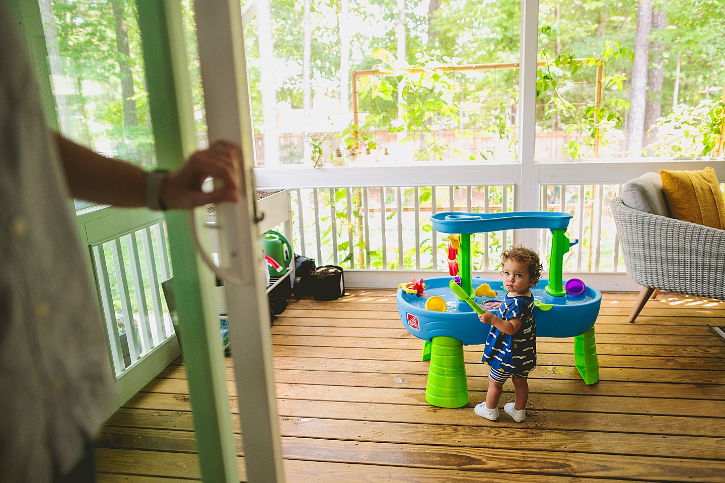 Baby playing with water table