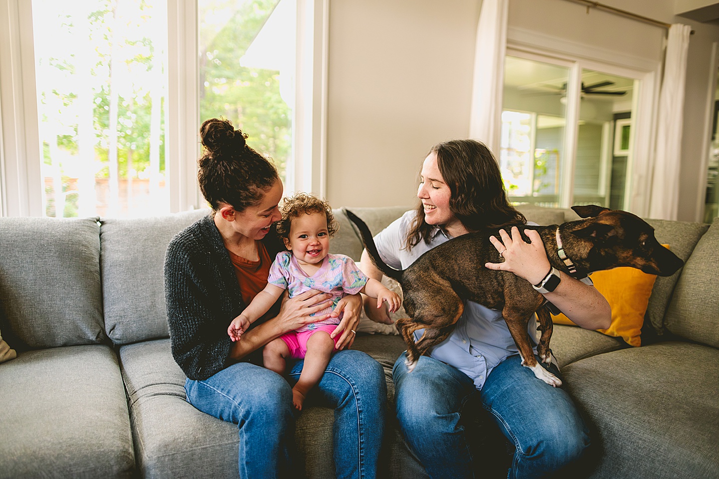 Family photos at home on couch in Durham NC