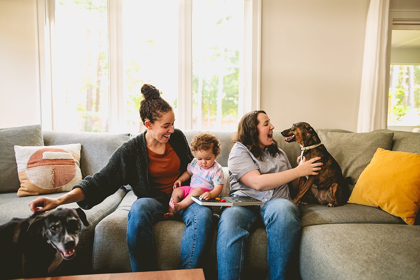 Family photos at home on couch in Durham NC