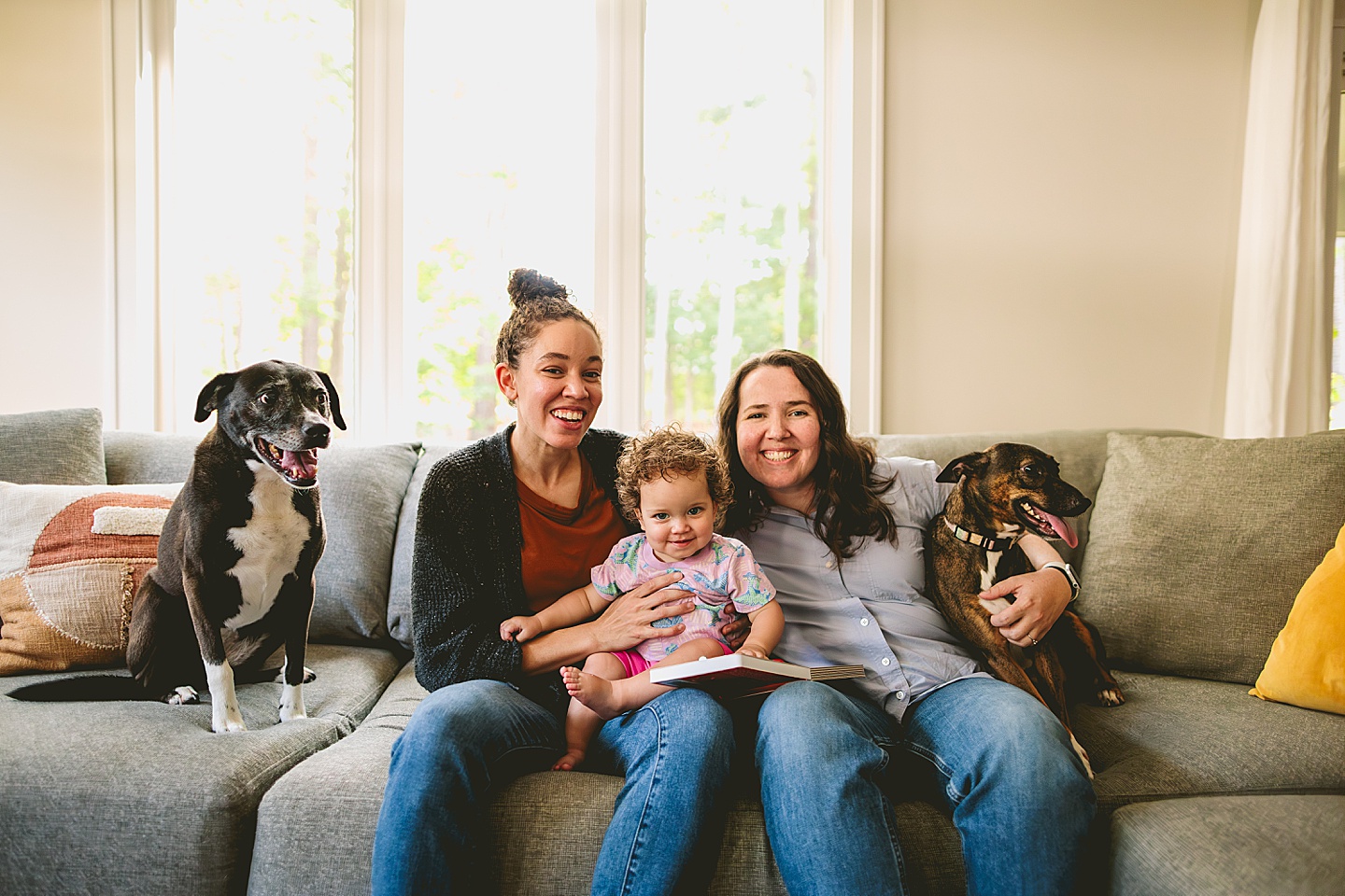 Family photos at home on couch in Durham NC