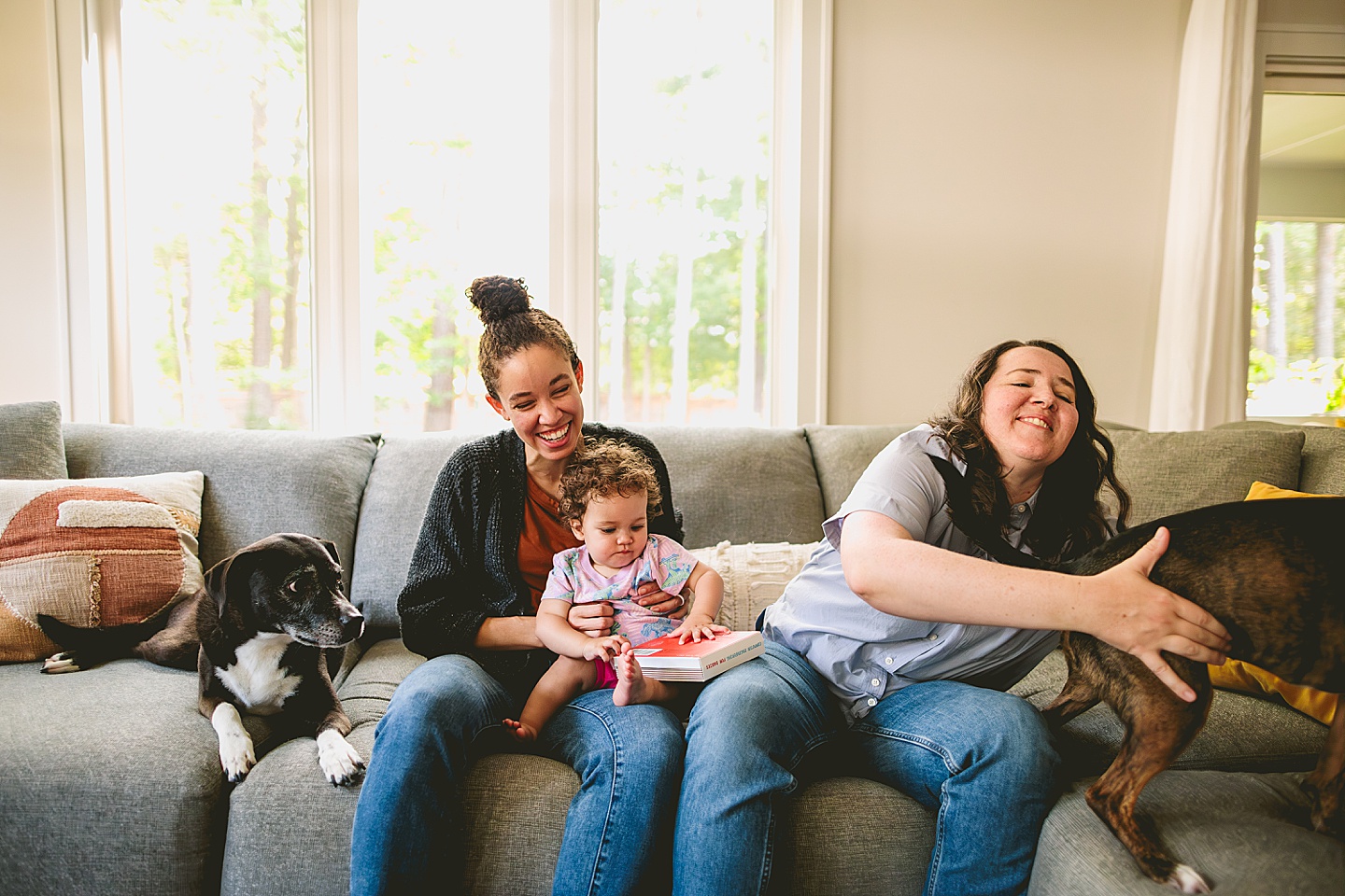 Family photos at home on couch in Durham NC