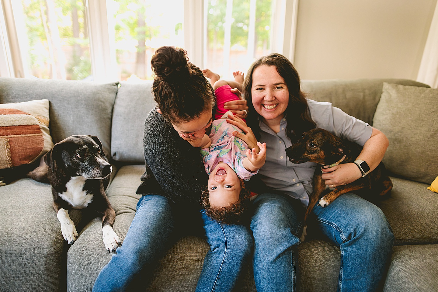 Family photos at home on couch in Durham NC