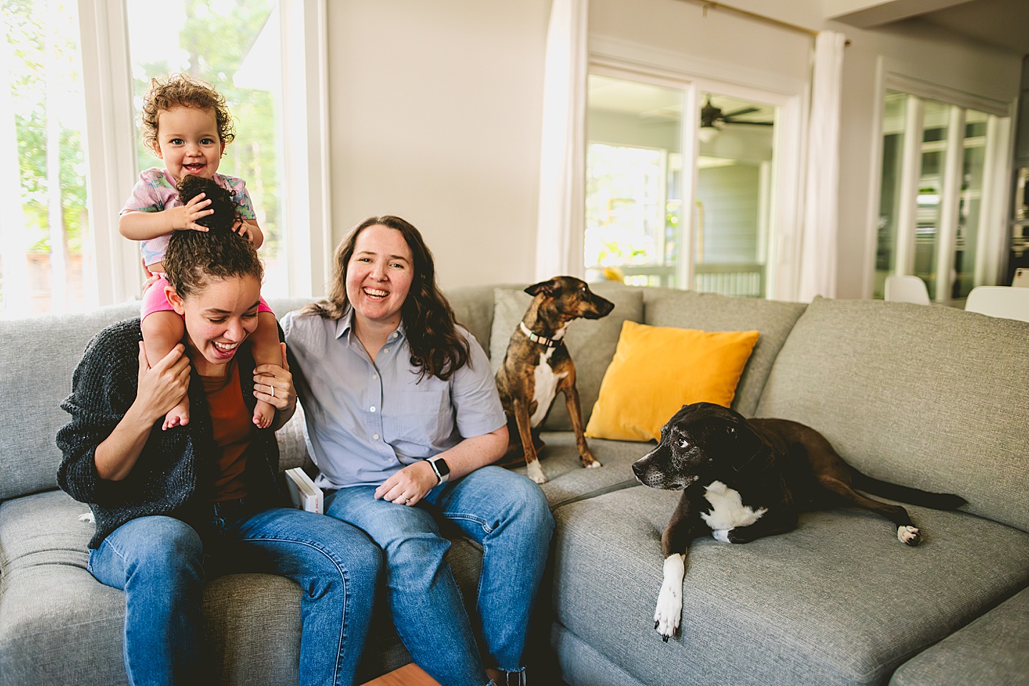 Family photos at home on couch in Durham NC