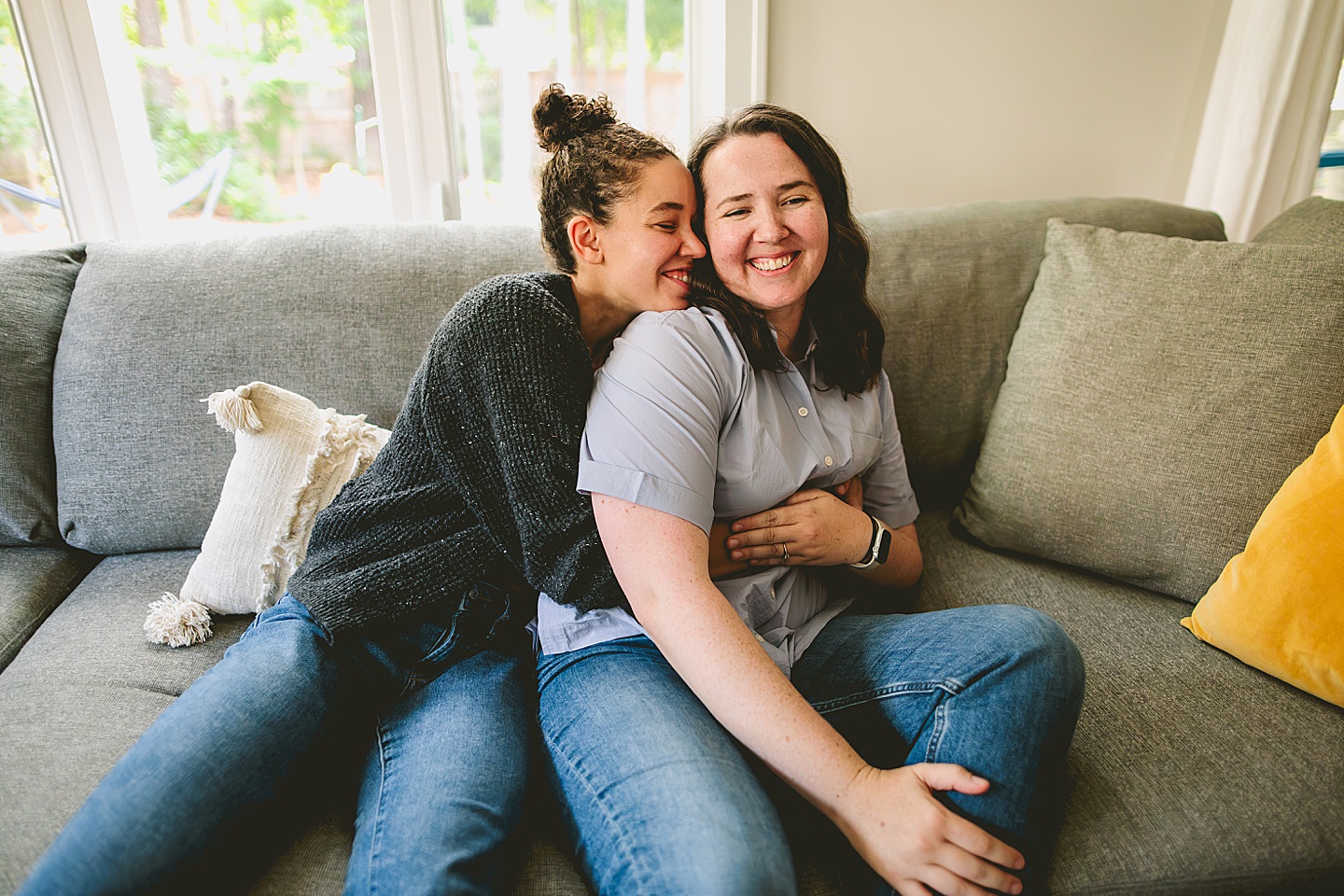 Family photos at home on couch in Durham NC