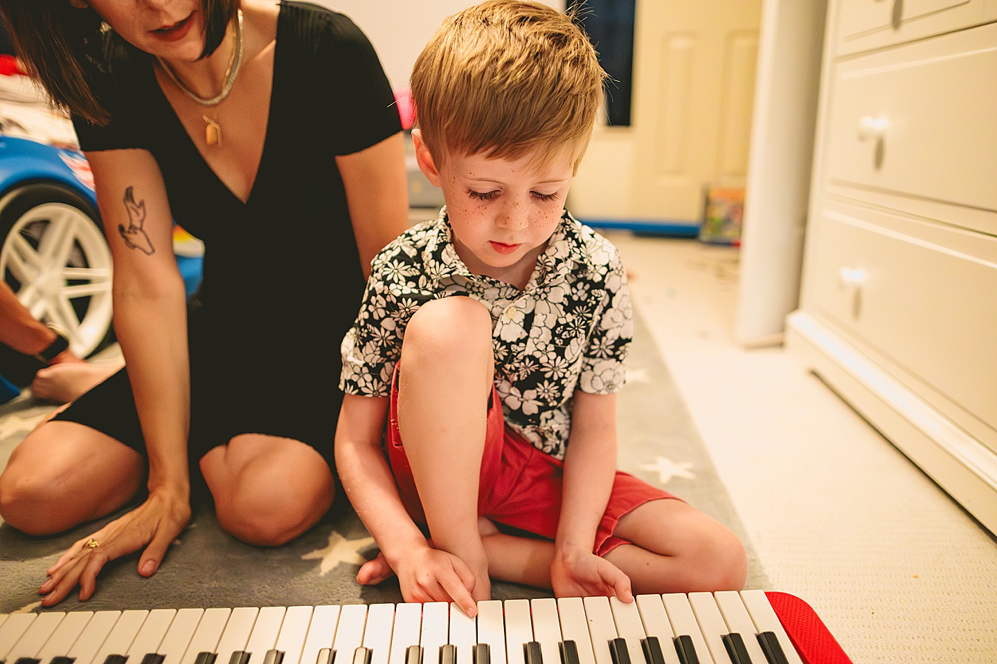 Boy playing a Casio keyboard