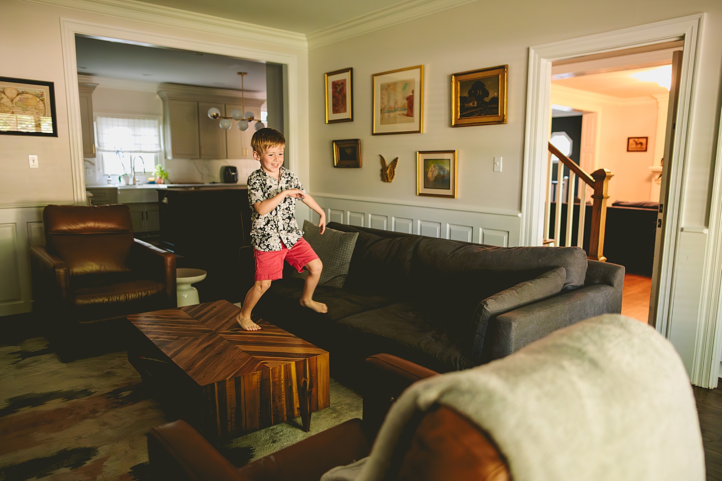 Boy pretending that the floor is made of lava