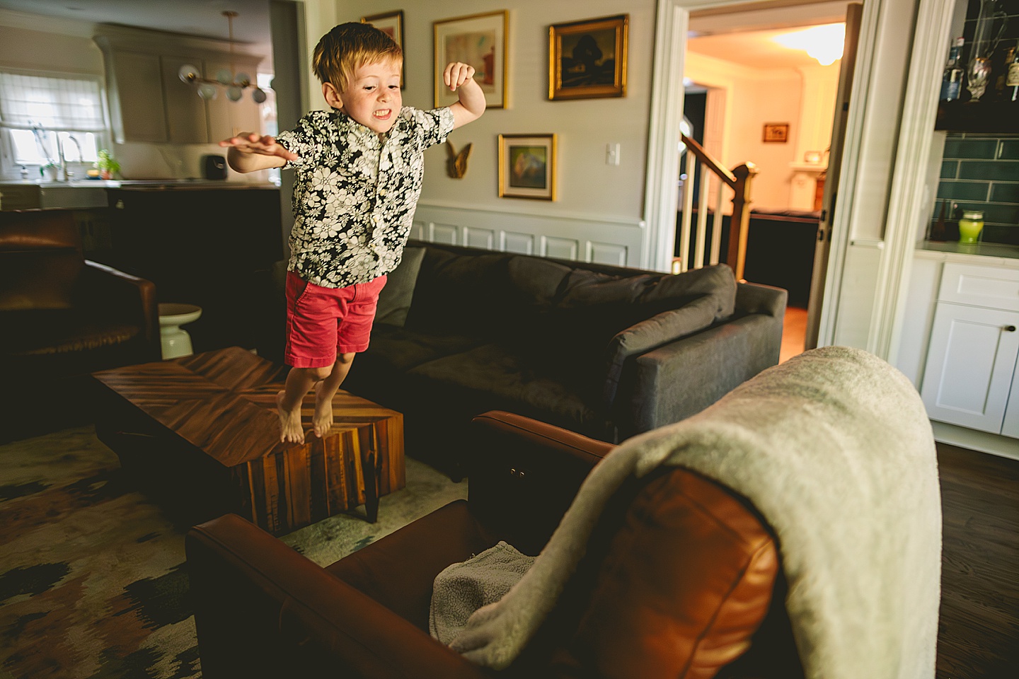 Boy pretending that the floor is made of lava