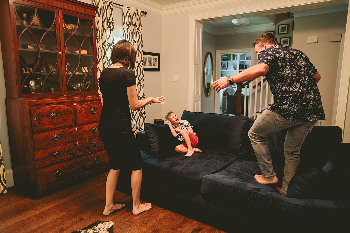 Kid goofing around with parents