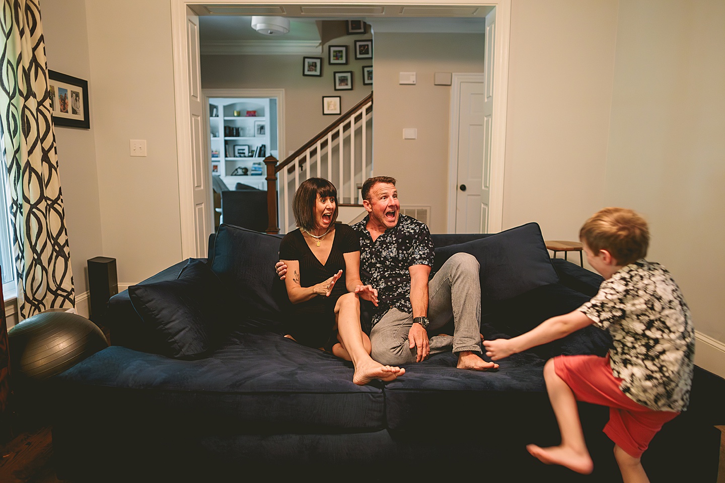 Kid goofing around with parents