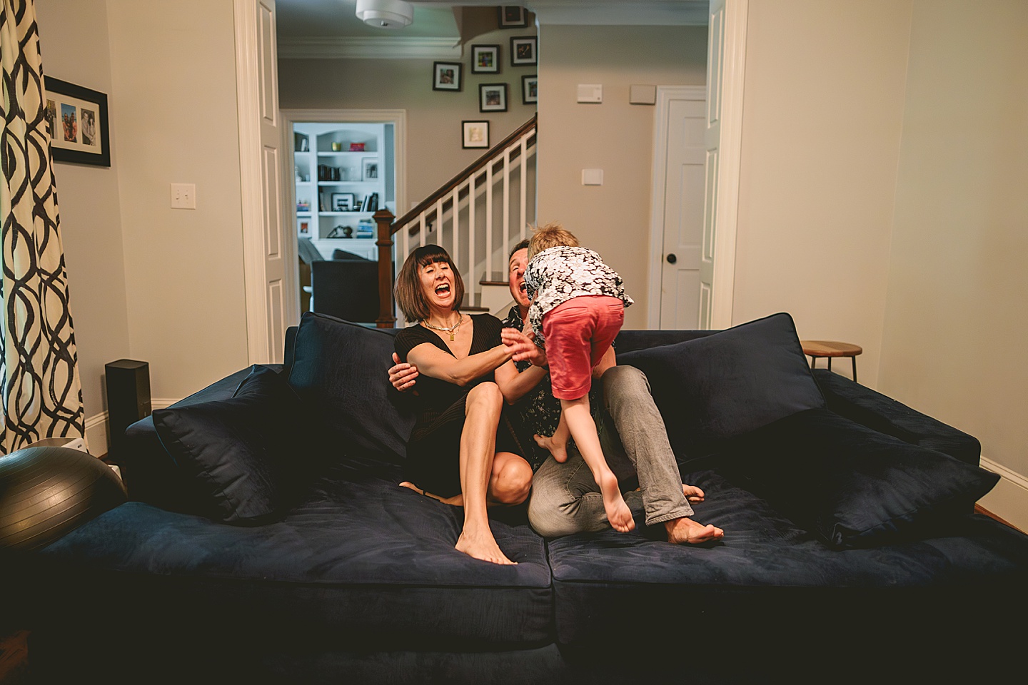 Kid goofing around with parents