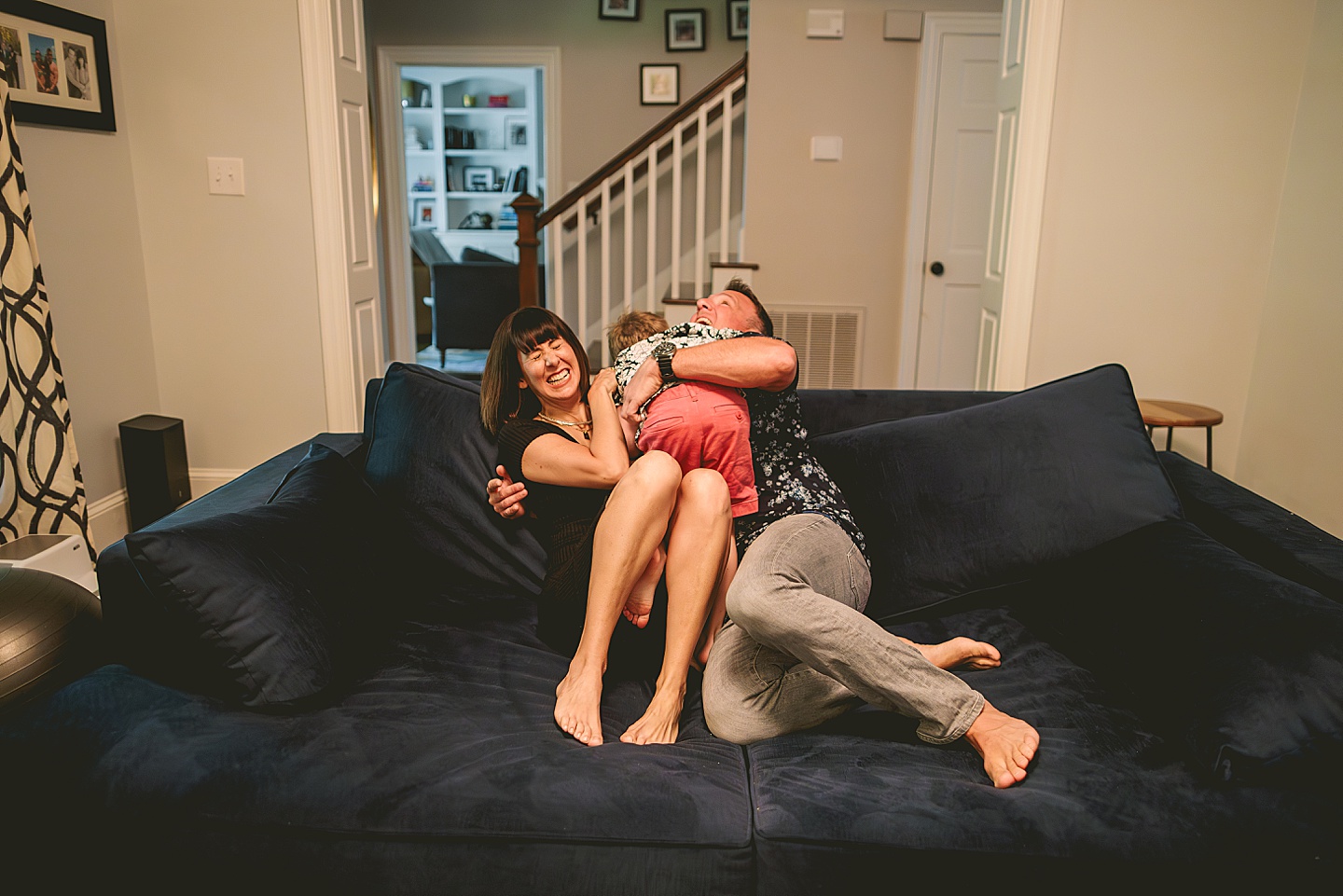 Kid goofing around with parents