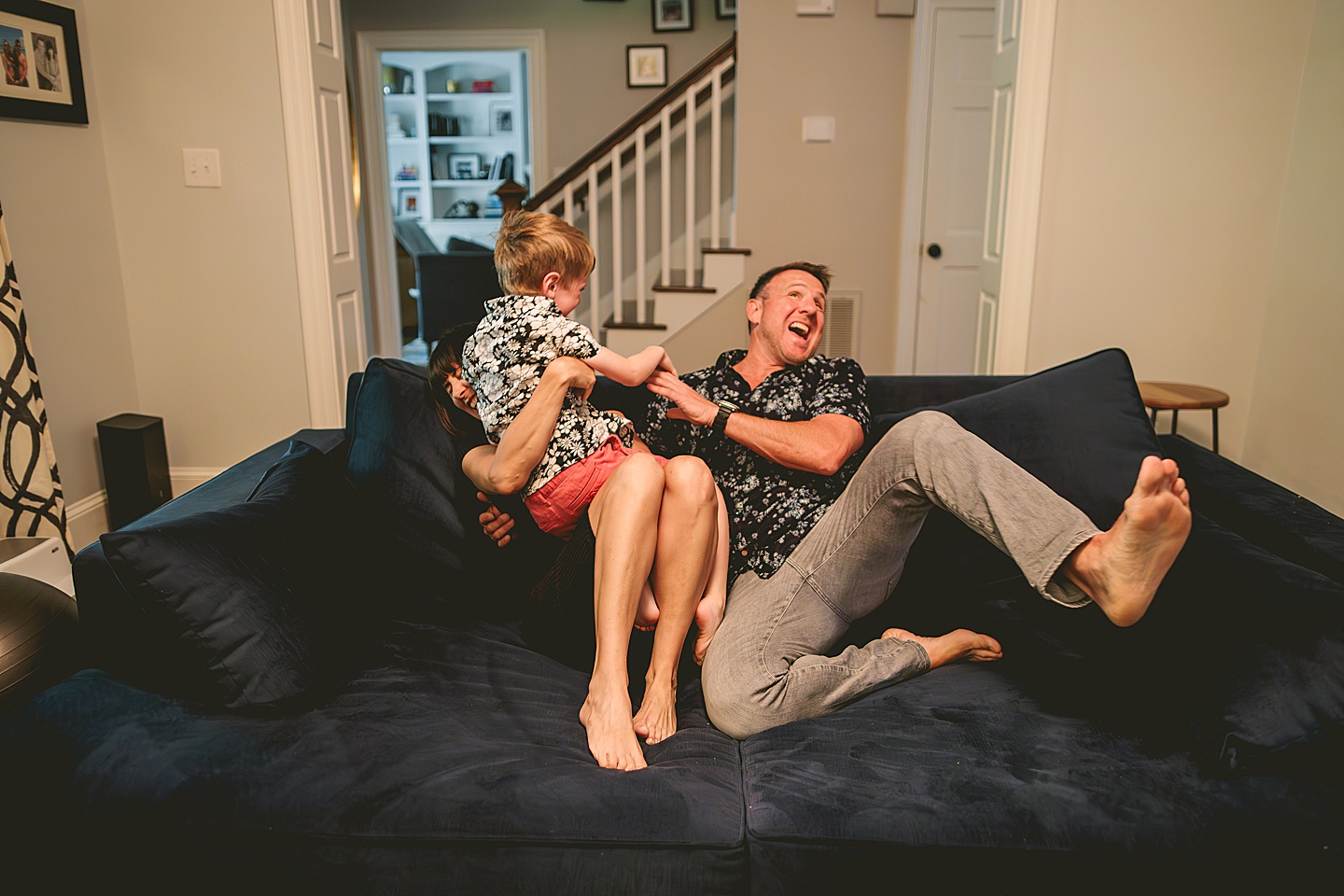 Kid goofing around with parents