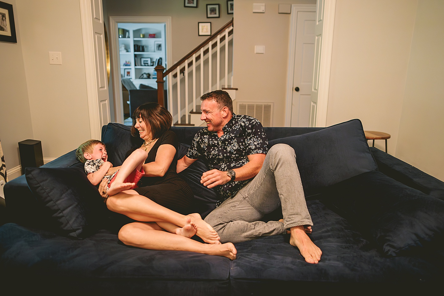 Kid goofing around with parents