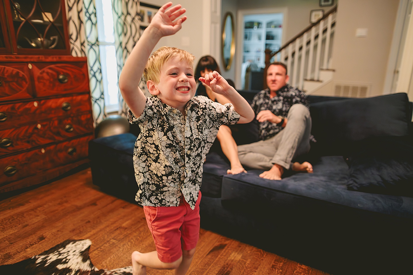 Kid goofing around with parents