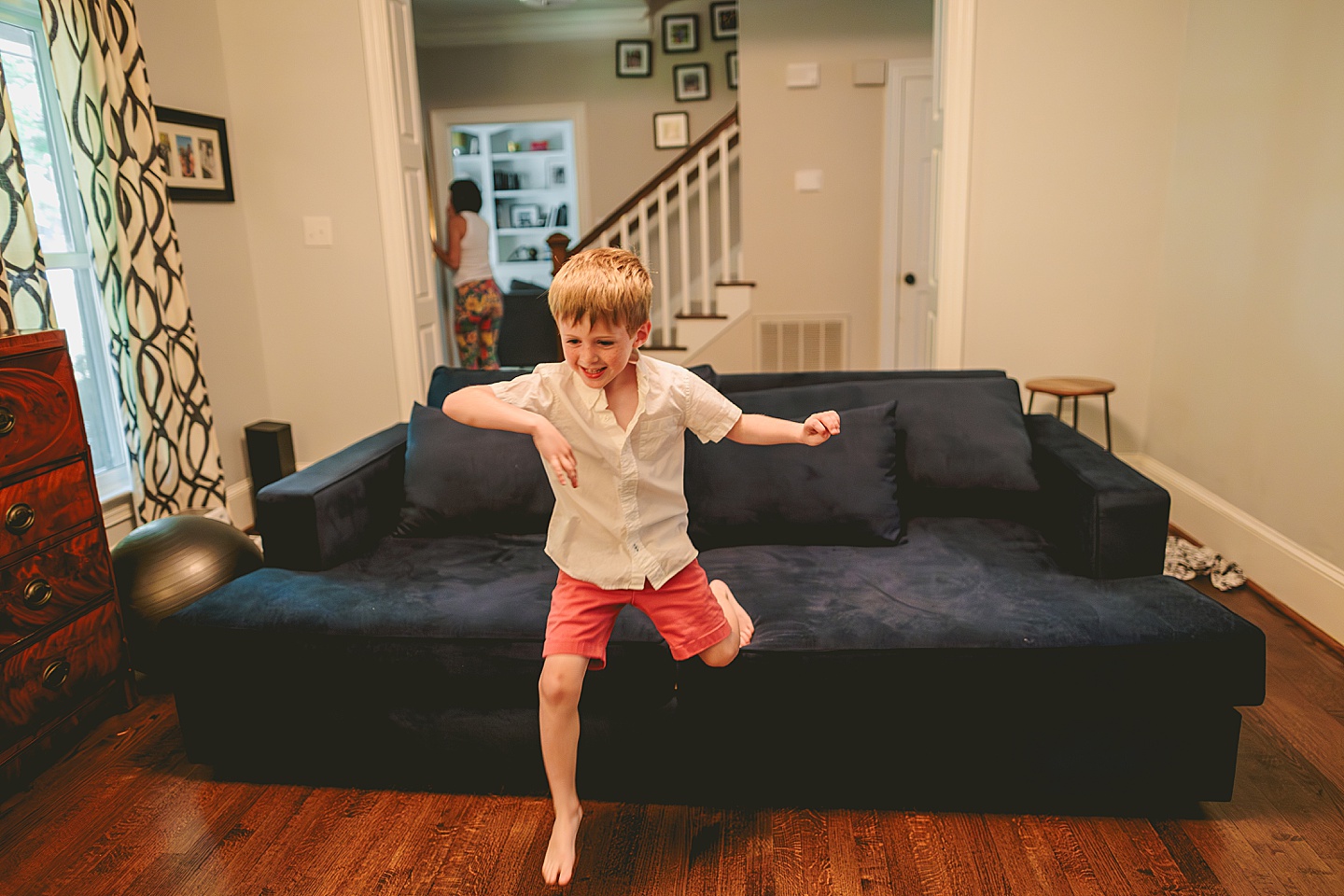 Kid jumping off couch