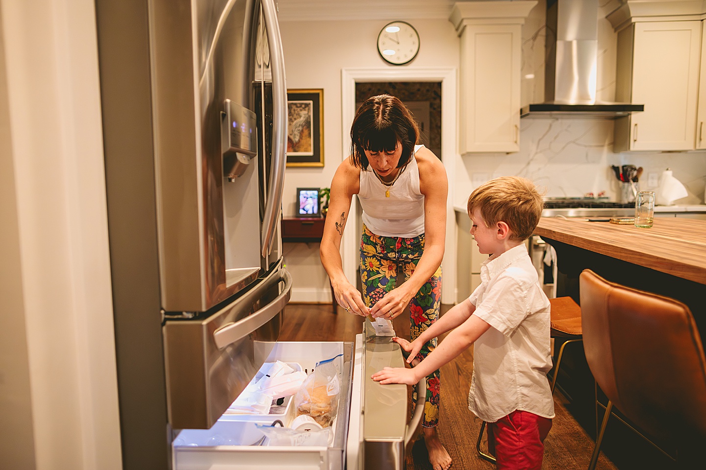 Mom and son look in the freezer