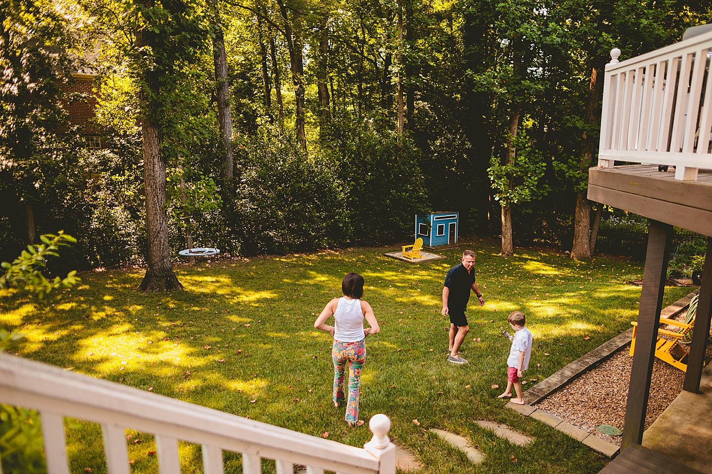 Parents and kid walk around outside