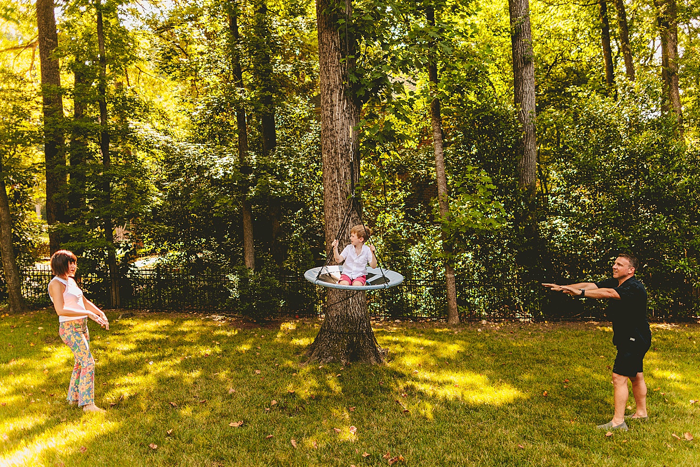 Kid swinging in backyard