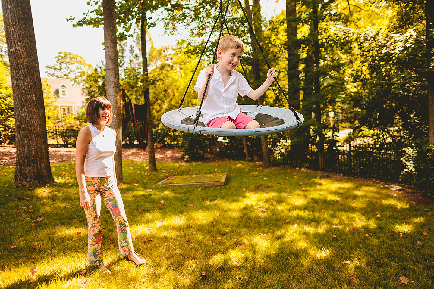 Kid swinging in backyard