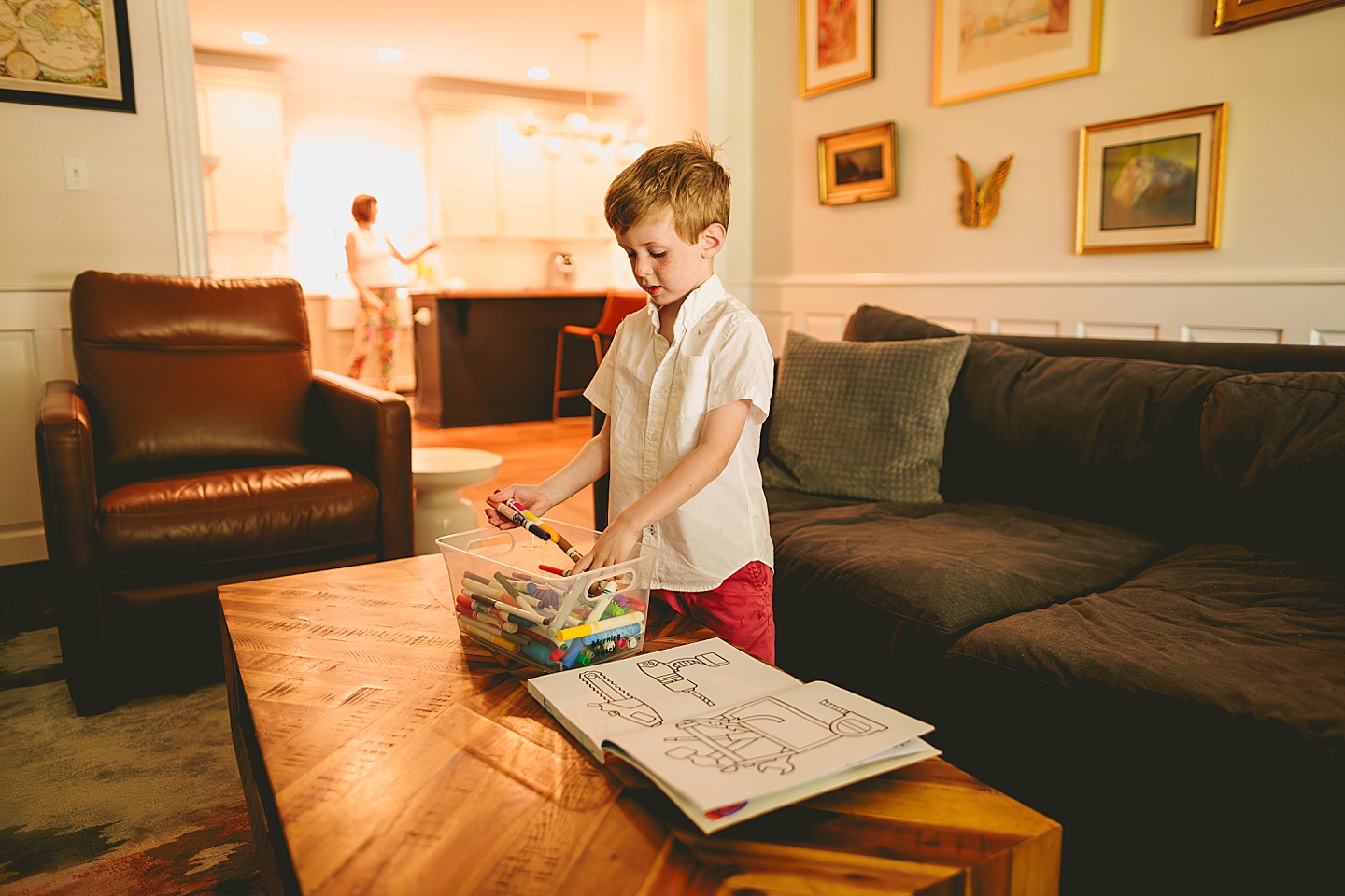 Boy coloring in living room