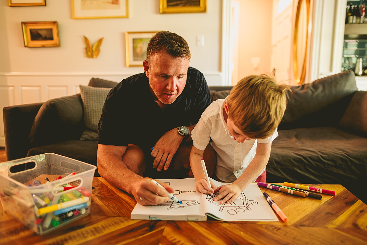 Boy coloring in living room