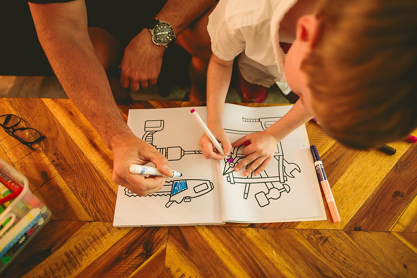 Boy coloring in living room