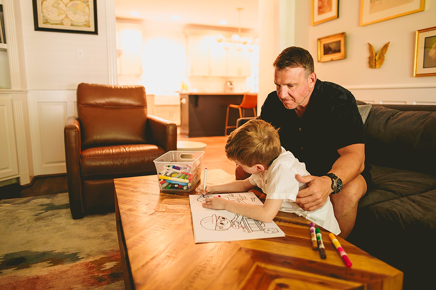 Boy coloring in living room